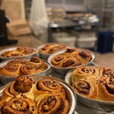 Brioche Cinnamon Rolls with pecans waiting for a light icing.