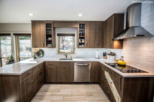 modern kitchen with slab doors and free standing hood. design and installed by Tile Center