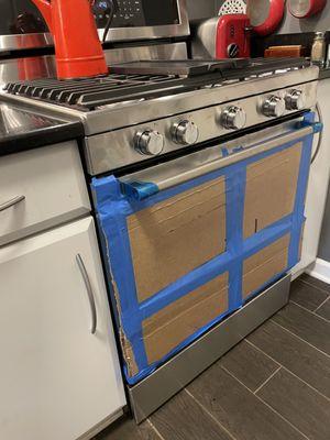 The installer's "solution". Don't feel safe cooking with a cardboard door