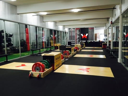 8 Olympic lifting platforms and 14 squat racks