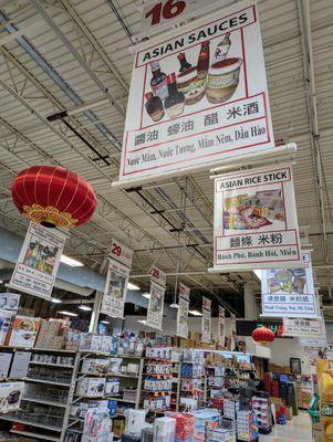 Inside. Aisle signs in English, Chinese, and Vietnamese.