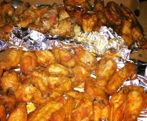 Order of 50 wings - $35. We got mild buffalo (bottom), hot teriyaki (top right), and garlic parm (top left).