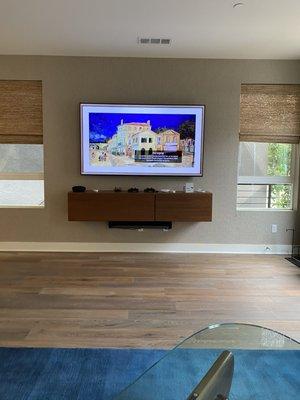 77 Inch LG OLED Television wall mounted on our super flush slim bracket with all wires concealed.