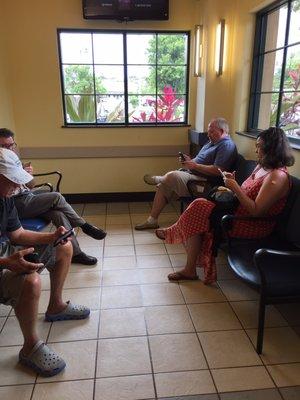 Waiting area with tv and magazines.