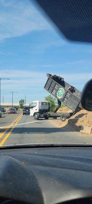 illegal dumping of trash, debris on the side of Adams ave near the i-95 onramp. even let piles of dirt in the roadway.