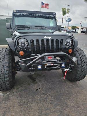 Poison spider stubby bumper. Warn winch. Fog lights. Synthetic winch line instead of cable. Aftermarket head lights.