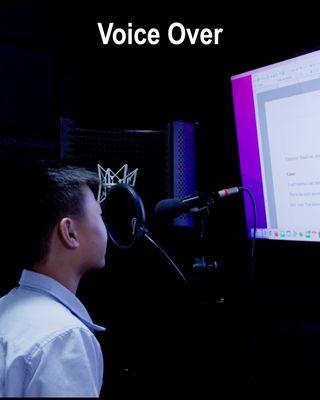 Our voice over student doing a voice over script at our commercial film shoot.