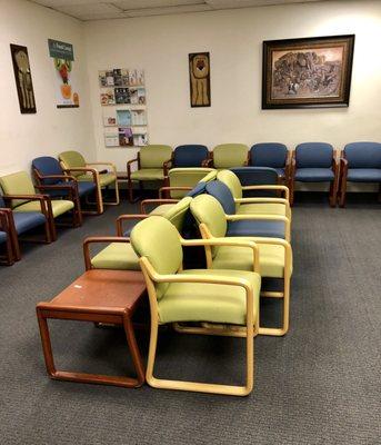 Spacious well child waiting room with toys and TV, running kids movies.