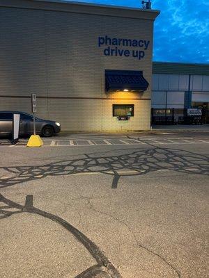 Photo of cardboard on window and line of cars that had been here before 8pm to get scripts