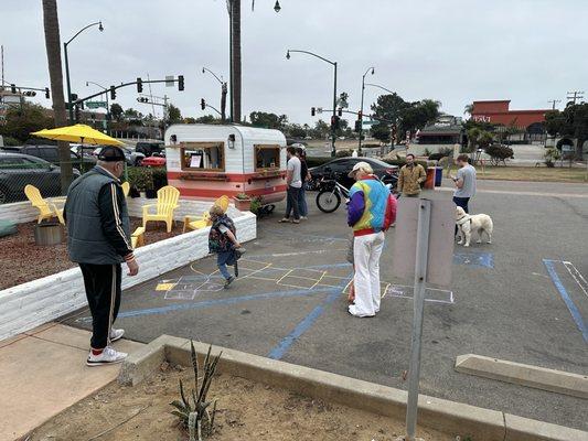 Community hanging out around Whatever Forever Coffee