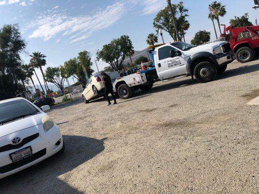 Their lot another girl getting her car towed