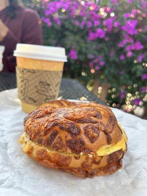 Bacon, egg and cheese on Asiago cheese bagel.