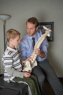 Dr. Kyle explaining the nervous system. At Adjust to Life Chiropractic we are passionate about educating our community.