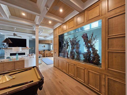 Aqua Creations' 1500-gallon saltwater fish tank in Beach Haven, NJ, dazzles with vibrant marine life, enhancing the beachfront home's beauty