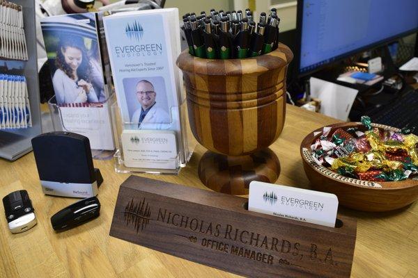 Nic's name plate at the Assistive Listening Device desk.