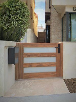 Modern Wood Gate with White Laminate Glass by Garden Passages