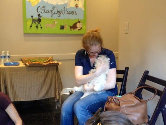 Devin snuggling with Edith at one of our Puppy Classes.