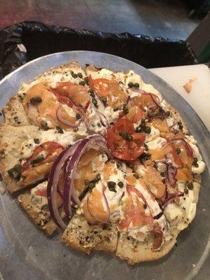 It's NY style bagel with cream cheese, Lox, onion, tomatoes,& capers.  Yum yum..... hold it it's a bagel pizza !!!