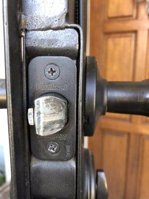 Sticky lock on security front door...