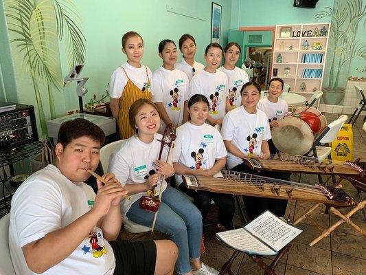 Visiting students coming to share traditional instruments and music with our guests