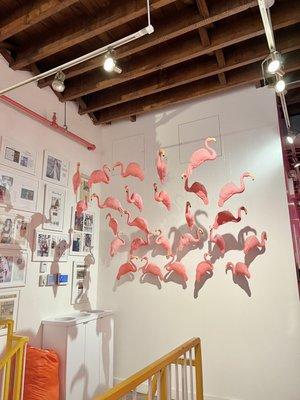 Cute flamingo decor by the stairs area