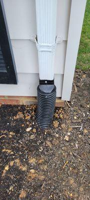 Downspout and brick repair