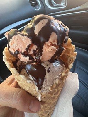 Regular sized 2 flavors with chocolate shell in a waffle cone