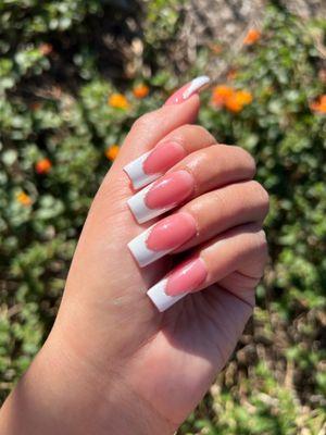 French tip manicure with glitter detail