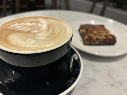 House latte with a walnut brownie