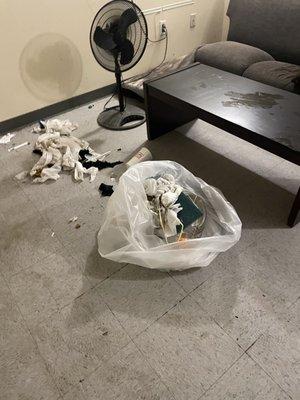 This is the living room downstairs nothing much trash but turn again I can't expect any better from a bunch of drug heads