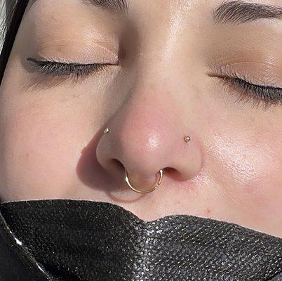 Septum piercing by Chris Saint