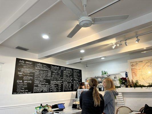 Menu board and cashier. Friendly service!