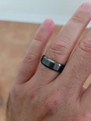 White gold ring that is rhodium plated. I'm super happy with it, fits great, and I hardly feel it.