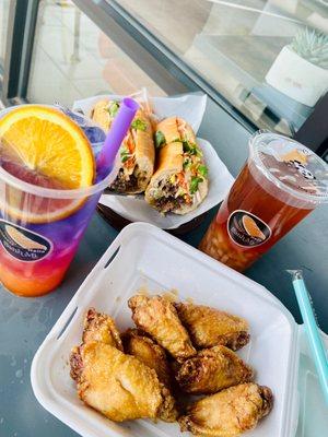 Lemongrass beef foot long sandwich and honey garlic chicken wings. Butterfly sunset tea ( the purple one) and peach tea.