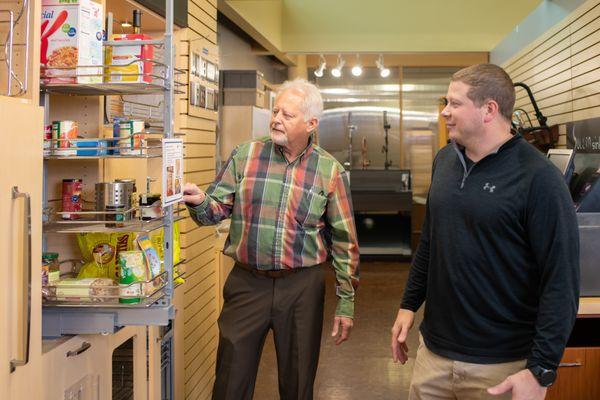 Discussing pantry organizer options in the NBH showroom.