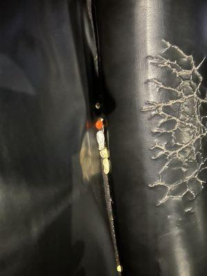 Cracked leather and food left in seat