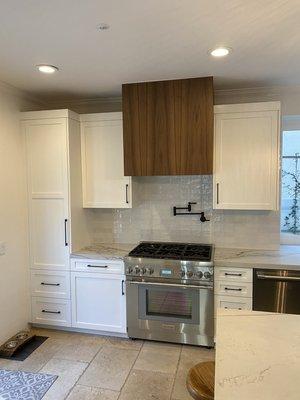 Shaker kitchen with walnut hood