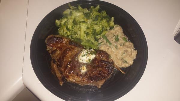 Delmonico cut ribeye (finished with homemade garlic herb butter) with brocoli and mushroom risotto...  Thanks Findley's!