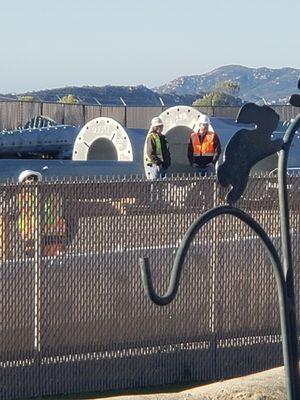 Workers scoping out my neighbor through her windows