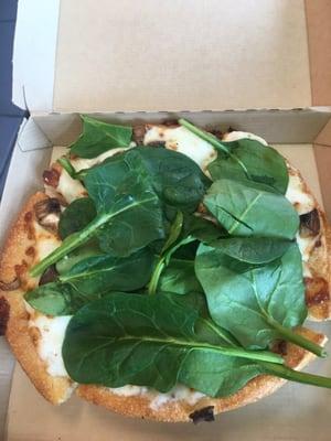 White personal pan with mushrooms and fresh spinach. Who knew?!