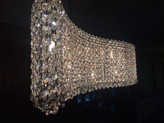 Chandelier install with all it's dazzle and sparkle.