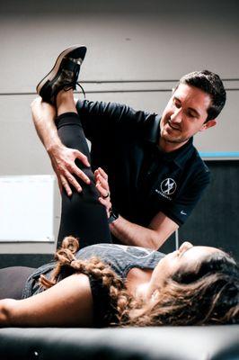 Dr. James McAfee, PT, DPT working with a patient with hamstring pain in Seattle.