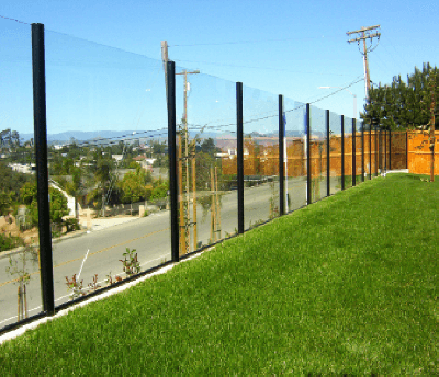 Glass fence on a mow curb.