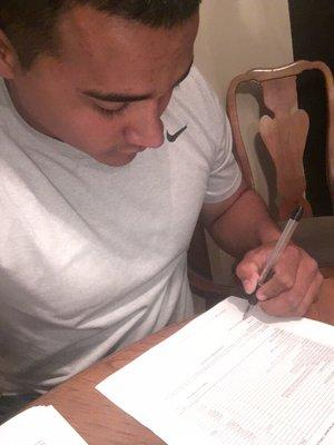 First time home buyer signing docs, so close to being in his new home for the Holidays!