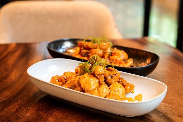 Coliflor Picante: Crispy cauliflower tossed in a spicy mayo sauce. A piqueo to share.