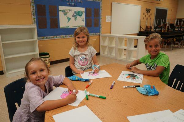 Children at VBS doing a fun coloring activity