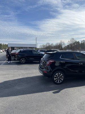 Me checking out my new vehicle along with my old trade in.