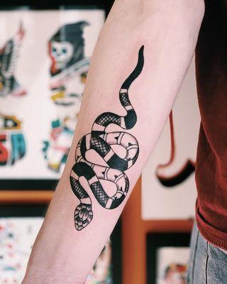 Snake tattoo by Ryan Bogart