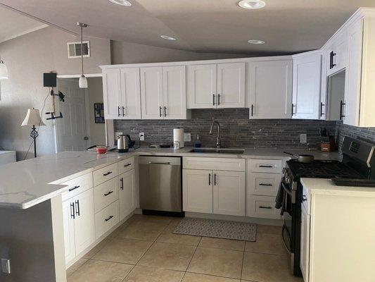 Kitchen after taking a wall down that divided the two rooms. It is so open and lit up now! Much better to cook in and entertain!!