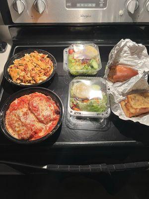 Take out order.  Chicken Parm, chicken penny pasta with vodka sauce, side, salads, and garlic bread.